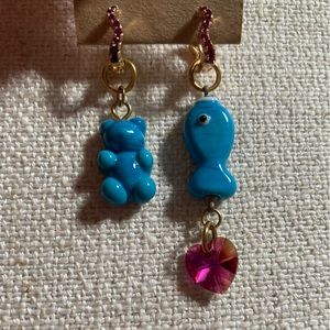 Gold plated earrings with handmade glass gummy bear and fish charms.